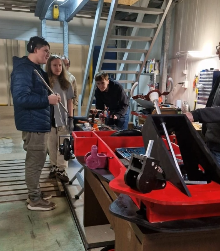 Student driving solar kart